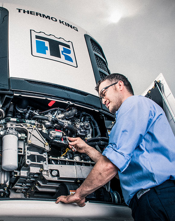 Service technician working on a trailer TRU